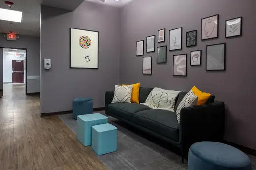 Cozy seating area with artwork at Avery’s House detox center in Idaho.