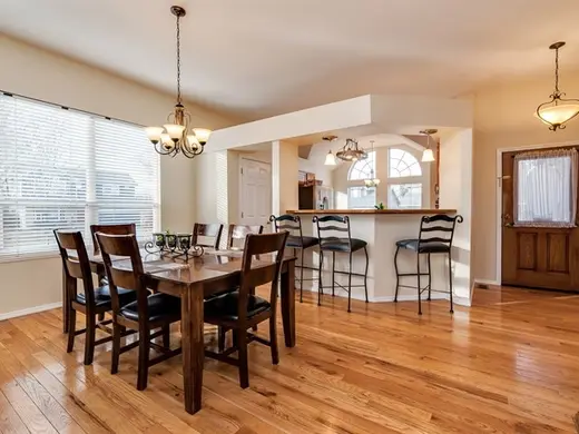 Bright dining area with wooden table at River Sober Living, LLC, a sober living home in Idaho.