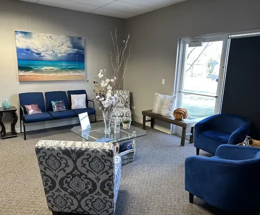 Cozy waiting area with blue chairs at K-Counseling & Anxiety Treatment, LLC, a treatment center in Idaho.